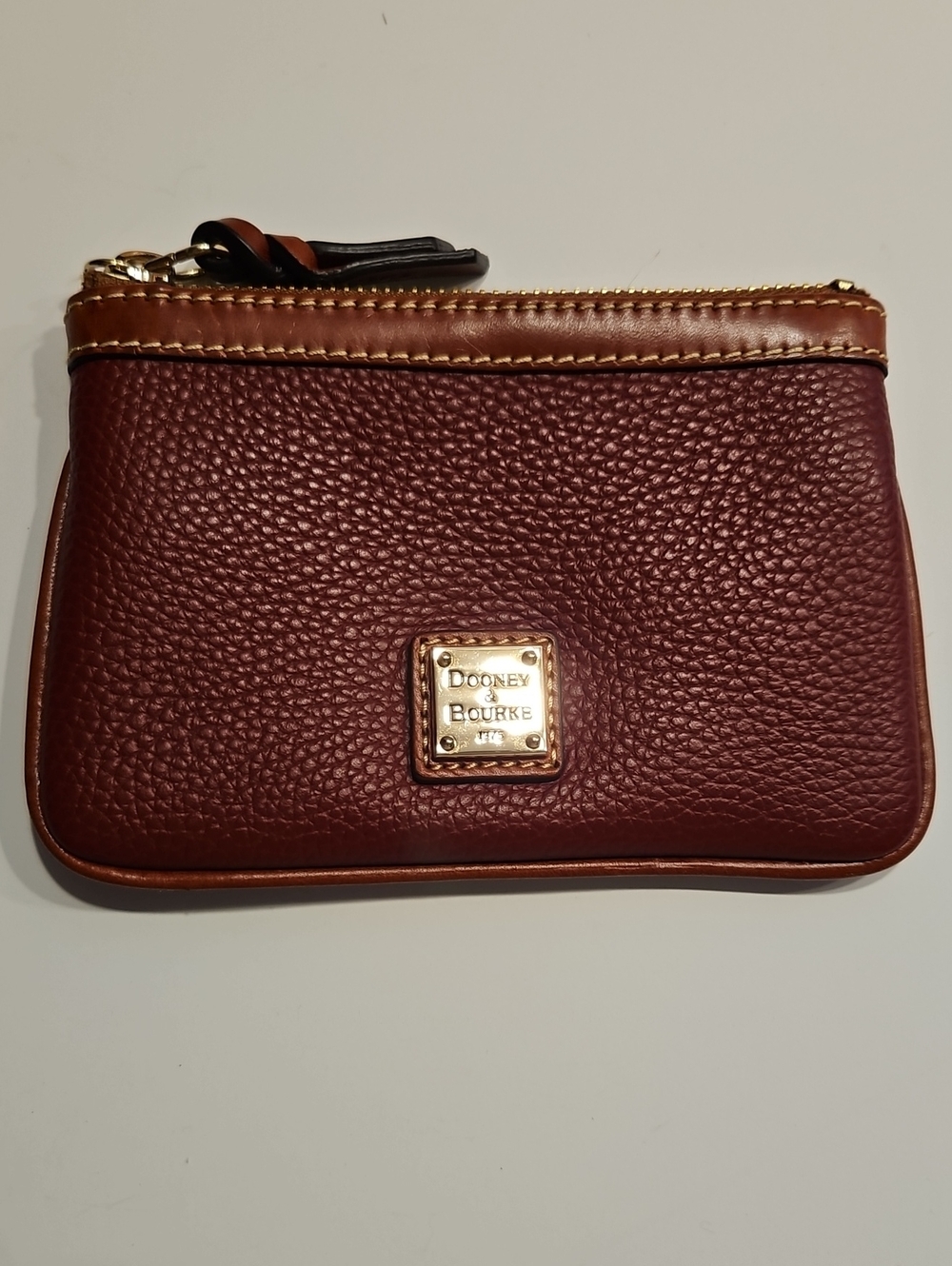 Dooney & Bourke Burgundy Pebbled Leather Zip Pouch With BrownTrim& Gold Hardware